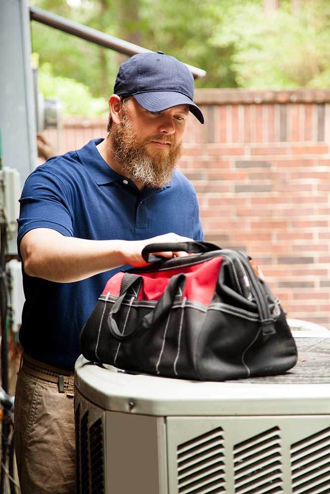 AC repair technician work